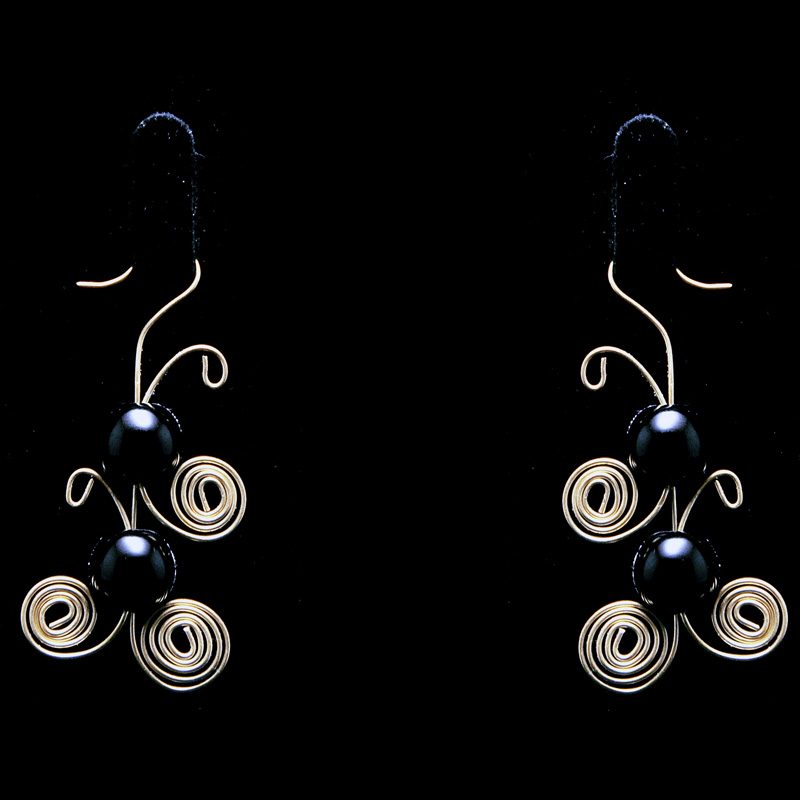 Handmade earrings with brass and black pearls