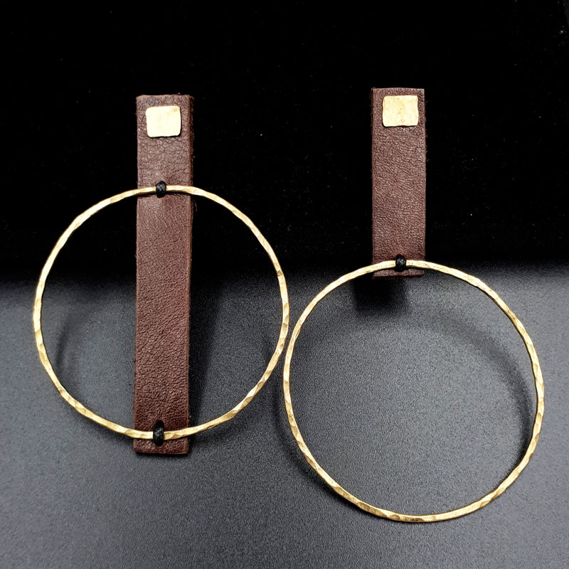 Handmade earrings with hammered brass and brown leather!