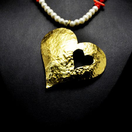 Handmade necklace with big heart made of hammered brass, pearls and semi-precious stones corals